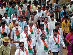 BJP State President K S Eshwarappa pariticipating in a road show as part of the election campaign in Kadur on Friday.