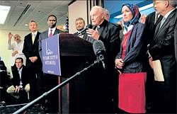 Peacemaker Cardinal Theodore Edgar Mccarrick and Dr Ingrid Mattson, President of the Islamic Society of North America, speak during a press conference where a coalition of religious leaders commented on anti-Muslim hate and acts of violence and intimidation against American Muslims in Washington on Sept 7. NYT