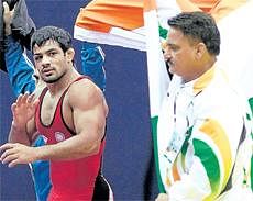 PROUD CHAMP Sushil Kumar (left) celebrates his victory over Russia's Alan Gogaev in their 66kg freestyle final at the World Wrestling Championships in Moscow on Sunday. AFP