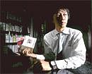 Kirito Nakano, who worked a side job before starting his own company, at his home office in Tokyo, on Sept. 3, 2010. Declining salaries and an unstable labor market have led young Japanese to work second or even third jobs. NYT