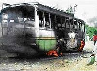 Burning Issue: A bus is in flames after it was set ablaze in Hisar on Tuesday by members of the Jat community during an agitation demanding reservation. PTI