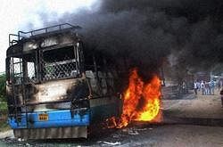 Haryana rodways bus torched by protesters demanding reservation for Jat community at a village Mayar in Hisar district of Haryana on Monday. PTI