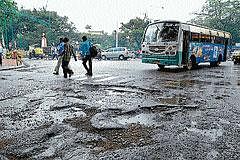 Pothole ridden road near Vishveshwaraiah Circle.