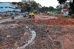 The KRS Road near Dasappa Circle in city which is being repaired at a snails pace. DH photo by Prashant H G