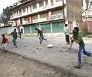 Kashmiri protesters hurl stones at Indian paramilitary soldiers, unseen during a protest in Srinagar, India. AP Photo