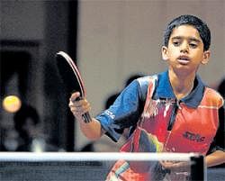 In control D Suraj returns on his way to a win in the quarterfinals over Vedanth M Urs at the State-ranking table tennis tournament on Friday. DH photo