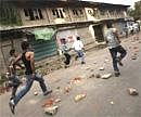 Kashmiri protesters run for cover as Indian paramilitary soldiers, unseen, chase them during a protest in Srinagar, India on Thursday. AP Photo