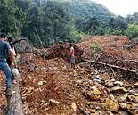 A view of the landslide that occurred at Hadageri village near Donimara Road area in Honnavar taluk of Uttara Kannada district on Saturday. DH Photo