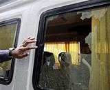 The shattered window of a bus suspected to have been attacked by gunmen near Jama Masjid mosque in New Delhi on Sunday. AP