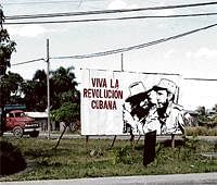 All set for a change:  A signboard by the roadside, depicting the Cuban revolution, near Havana.
