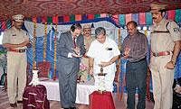Home Minister Dr V S Acharya inaugurating Malpe unit of Home Guards and legal awareness programme in Udupi on Sunday.