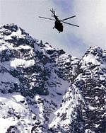 A file photo of an Indian Air Force MI-17 helicopter during  a search operation over the snow-capped mountains of  Srinagar.