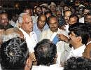 Surapur MLA Narasimha Naiks followers submitting a memorandum to Chief Minister B S Yeddyurappa seeking the induction of their MLA into the Cabinet, after he arrived at  Bangalore on Monday. DH Photo