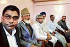 Chairman of hardline faction of All Parties Hurriyat Conference Syed Ali Shah Geelani (2nd left) looks on during a meeting with the parliamentary delegation at his residence in Srinagar on Monday. AFP