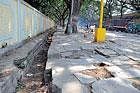 The stone slabs that have come out in front of the School for the Blind on New Sayyaji Rao Road in city. dh photo