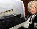 A May 19, 2003 photo from files of Millvina Dean the last living survivor of the Titanic disaster with a painting of the vessel, at an unknown location in England. AP