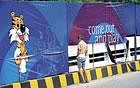 Snapshot India:  A labourer urinates in front of a Commonwealth Games banner in New Delhi on Thursday. AFP