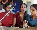 Students sing Nadageethe before the Teachers Day programme was inaugurated at the Womens Government First Grade College, Kolar, on Wednesday. DH PHOTO
