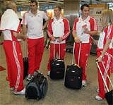 England players are seen as they check-in for their flight to attend the Commonwealth Games in New Delhi,  at London's Heathrow airport, Thursday, AP