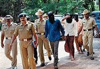 Police bringing accused in the murder case of Rowdy-sheeter Umesh Rai in Mangalore on  Friday. DH Photo