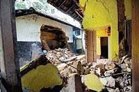 A partial view of the house located between Kankanady and Pumpwell in Mangalore, which was damaged due to heavy rains on Thursday night. Nobody has injured in the mishap. DH photo