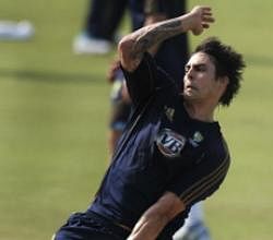 Australian cricketer Mitchell Johnson bowls at the nets. AFP