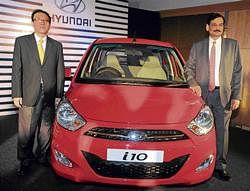Hyundai South Zone - Sales & Marketing Head Y S Kim and Director Marketing Arvind Saxena, launching the  new Hyundai i10 in Bangalore on Saturday. DH PHOTO