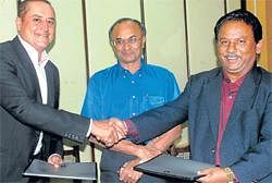 A pact: (Left) InstaColl Founder Sabeer Bhatia, Principal Secretary e-governance M N Vidyashankar and VTU Vice Chancellor Dr Maheshappa greeting each other after signing a MoU on e-mail application for state-wide implementation in Bangalore on Saturday. KPN
