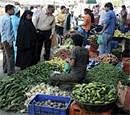 People buying vegetables at Hari Singh High Street market during relaxation in Srinagar on Saturday. PTI
