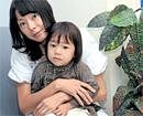 CONTENT Akiko with son Seiji.