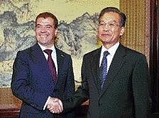 Russian President Dmitry Medvedev (left) shakes hands with Chinese Premier Wen Jiabao before their meeting at  Zhongnanhai in Beijing on Monday. REUTERS