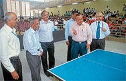 Serve: Honorary secretary of NIE, S L Ramachandra playing a game of Table Tennis to inaugurate the Badminton, Table Tennis and Chess Tournaments at NIE Diamond Jubilee Indoor Sports Complex in Mysore on Monday. Director of Physical Education, UoM, Dr C Krishna, Principal, NIE, Dr M S Shivakumar, Sports Chairman, T K Chittaranjan, physical education director, Shankaranarayan and Kantharaj look on. DH Photo
