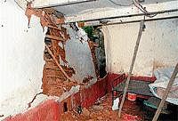 Destruction: A wall of a house collapsed following heavy rains that lashed on Sunday night, in Hassan on Monday. DH Photo