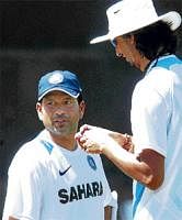 Gearing up:  Sachin Tendulkar and Ishant Sharma chat during a practice session at Chandigarh on Monday. AP