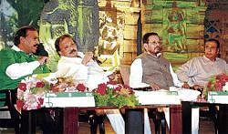 Interaction: Minister G Janardhana Reddy, MLA Roshan Baig, MP D B Chandregowda and environmentalist Suresh Heblikar discussing at the World Tourism Day programme organised by the Tourism Department in Bangalore on Monday. DH Photo