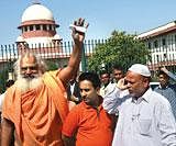 WAIT IS OVER: Representatives of the parties involved in the Ramjanmabhumi-Babri Masjid  title suits react over the Supreme Court decision on the plea seeking deferment of the verdict on the case in New Delhi on Tuesday. PTI