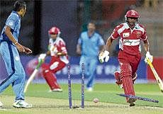 see you later!: Mangalore Uniteds Azghar Pasha is run out by a direct hit from Thilak Naidu in the KPL final at the  Chinnaswamy stadium on Wednesday night. DH photo / Srikanta Sharma R