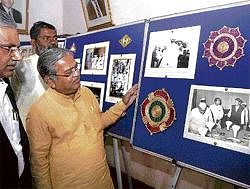 Glimpse of history: Irrigation Minister Govind Karjol having a look at the old pre- and post-Independence records after inaugurating the exhibition organised by the State Archives Department at Central college in Bangalore on Wednesday. DH Photo
