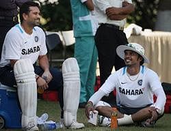 Sachin Tendulkar and S Sreesanth share a light moment during a practice session in Mohali on Thursday a day before the first cricket test match against Australia. PTI