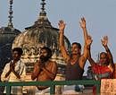 Hindu devotees pray after bathing at the Rama Ghat on the bank of Saryu River in Ayodhya, India, Saturday, Oct. 2, 2010. Schools, shops and businesses reopened in Ayodhya, Varanasi, Lucknow and other potentially explosive places with a mixed population of Hindus and Muslims Friday as fears of violence ebbed in northern India following a court order to divide a disputed holy site between the Hindu and Muslim communities. AP