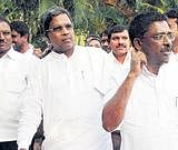 Opposition leader Siddaramaiah leaves his residence after a meeting with Congress legislators in Bangalore on Friday. KPN