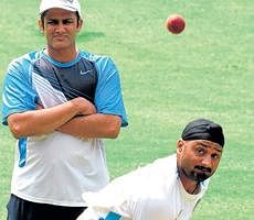 Watched by former India skipper Anil Kumble, Harbhajan Singh goes through his paces in Bangalore on Friday. DH Photo/ Srikanta Sharma R
