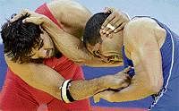 Golden boy:  Anil Kumar (left) was one of the heroes for India in the Greco-Roman wrestling category, where India bagged four golds. DH Photo/ Kishor Kumar Bolar