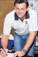 Sign of a legend: Australias Adam Gilchrist signs the MoU between University of Wollongong and Mphasis in Bangalore on Saturday. DH photo