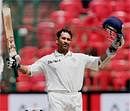 Sachin Tendulkar celebrates after scoring a century on the 3rd day of the 2nd test match against Australia at Chinnaswamy Stadium in Bangalore on Monday. PTI