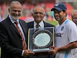 Master Blaster Sachin Tendulkar is felicitated by KSCA Secretary Brijesh Patel for his 14000 runs in test cricket before the start of 5th day's play of the 2nd test match at Chinnaswamy Stadium in Bangalore on Wednesday