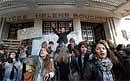 Students block the entrance of their high school on Thursday in Paris to protest against President Nicolas Sarkozys  pensions reform. AFP