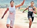 Sprinting home: Sanjay V (left) powers his way to the 100M gold in the BU meet on Thursday. DH Photo