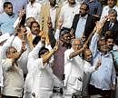 Elated: Chief Minister B S Yeddyurappa along with Cabinet ministers and other MLAs showing the victory sign after winning the vote of confidence in Assembly on Thursday. DH PHOTO