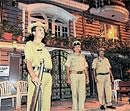 JUST IN CASE: Police guarding the house ofMC Ashwatha in MC Layout, Vijayanagar on Friday. DH PHOTO/ SHIVAKUMARBH